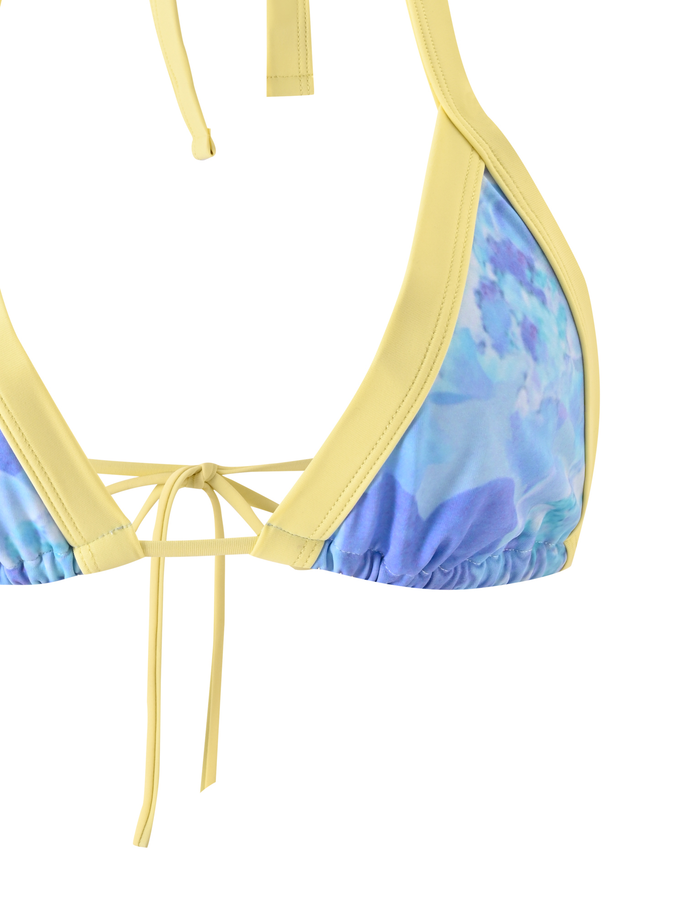 The TIGERMIST EMBERLAIN BIKINI TOP - BLUE MACRO FLORAL features yellow straps and trim, a vibrant blue and purple watercolor floral print on high-stretch fabric, and back ties styled in a neat bow.