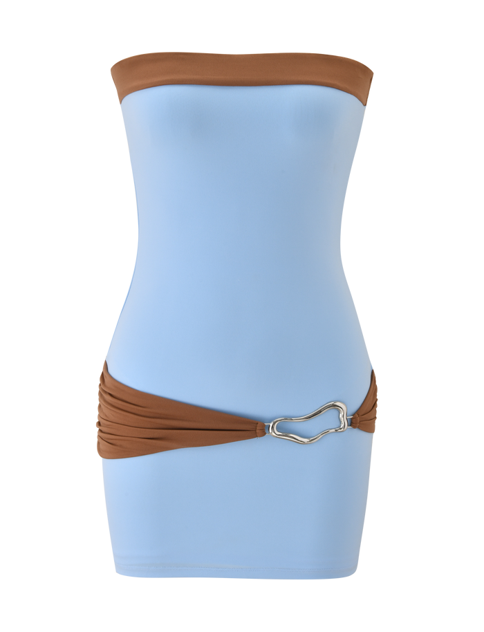 The EOS MINI DRESS by TIGERMIST features a soft blue strapless mini silhouette with mocha accents and a silver heart-shaped buckle for an effortlessly chic color-blocked look.
