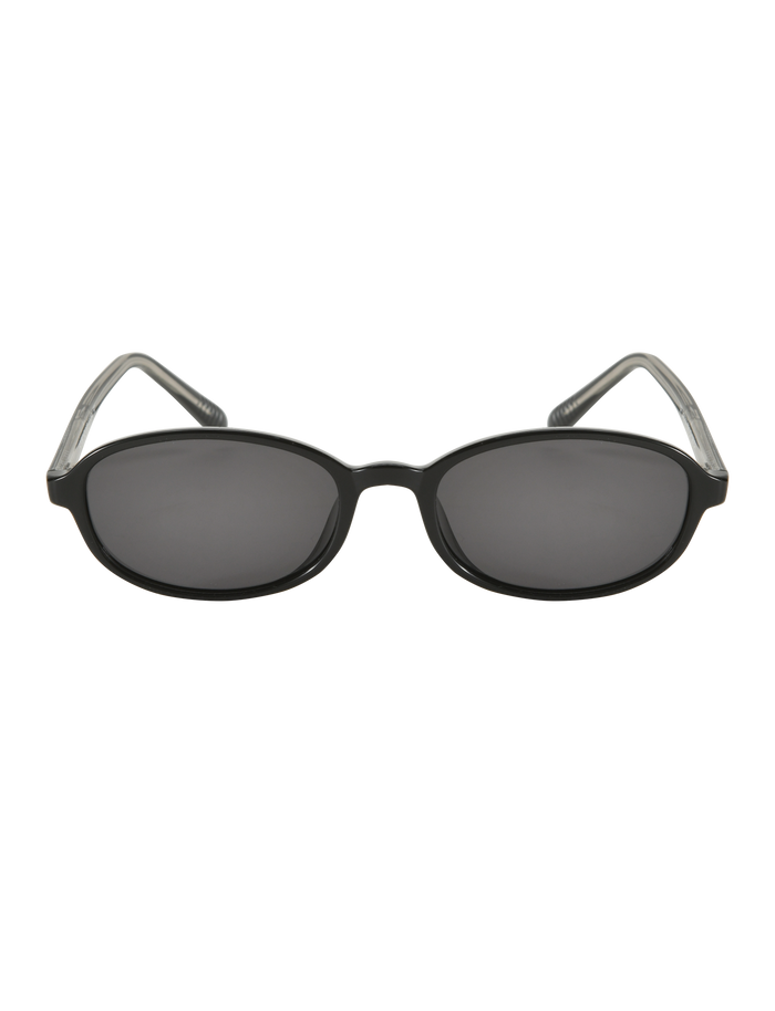 The ESTA GLASSES - BLACK by TIGERMIST feature black oval frames, dark polarised lenses, transparent arm tips, and UV400 protection. Shown on a plain white background.