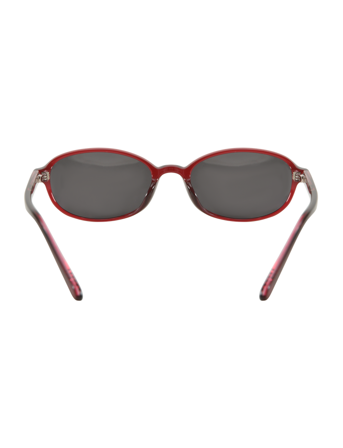 ESTA GLASSES - RED by TIGERMIST are stylish fashion sunglasses featuring oval dark lenses, a thin red frame, slightly curved arms, and provide UV400 protection. Set against a plain white background.
