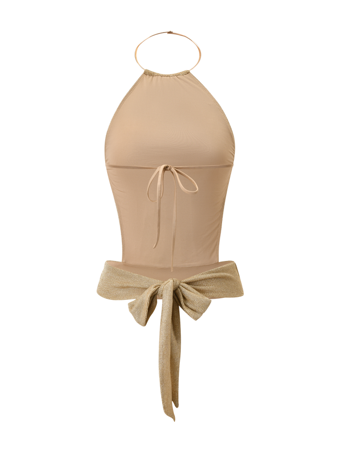 The EVANNA TOP - GOLD by TIGERMIST is a beige high-neck halter bodysuit with a gold neck strap, front tie detail, and a large shimmery gold bow accent at the waist, shown on a white background.