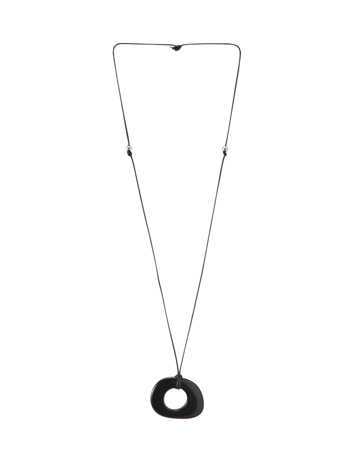 The FAELLA PENDANT NECKLACE - BLACK by TIGERMIST features a sleek black resin pendant on a thin, adjustable black cord for effortless minimalist style.