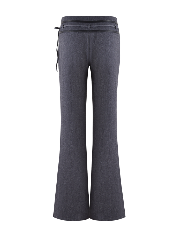 The FEDRA PANT - GREY by TIGERMIST is a pair of high-waisted, dark gray suit pants with a subtle texture, back view, featuring belt loops on the waistband and a slim left-side belt.
