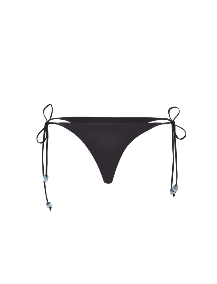 The FINLEA BIKINI BOTTOM - BLACK : BUTTERFLY by TIGERMIST is a black elastane bikini brief with tie sides and decorative bows at each hip, featuring a cheeky cut, shown against a white background.
