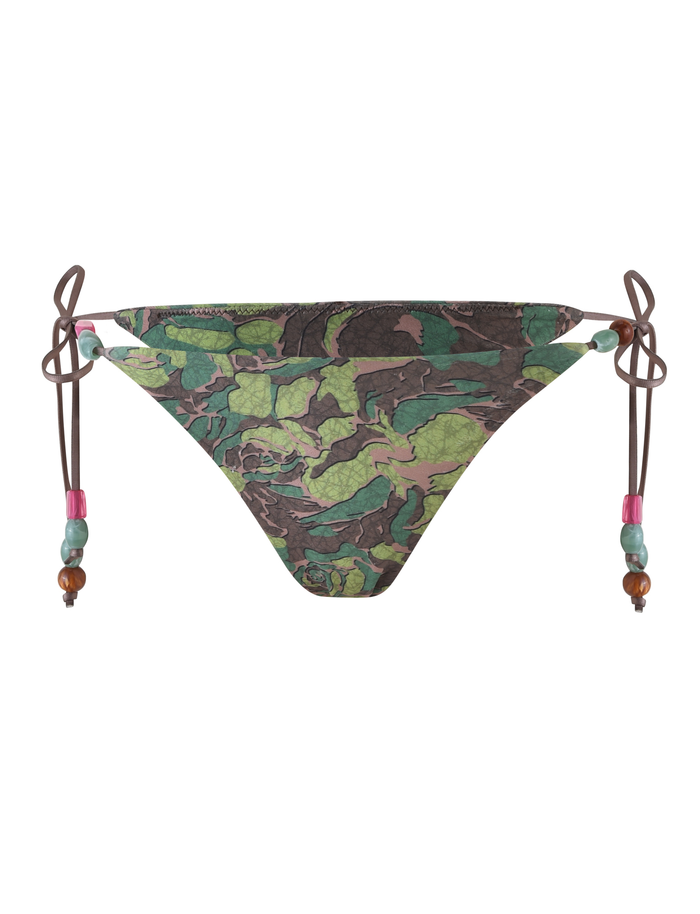 The FINLEA BIKINI BOTTOM - GREEN : CAMO by TIGERMIST features a green and brown leaf camouflage print, a cheeky cut, and brown side ties with pink, blue, and brown bead accents.