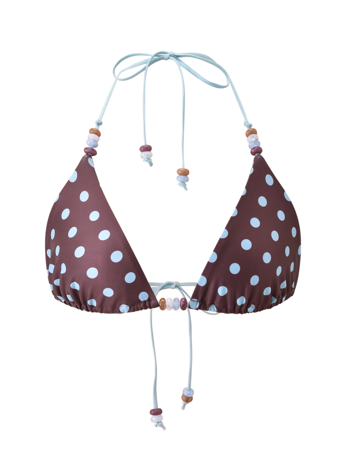 The TIGERMIST FINLEA BIKINI TOP - BROWN AND BLUE POLKA DOT features white spots, light blue straps, colorful bead accents, and a halter triangle design. It is displayed on a white background.
