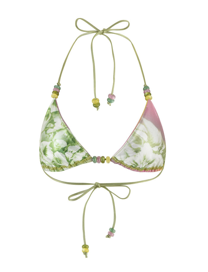 Discover the stunning appeal of the FINLEA BIKINI TOP by TIGERMIST. This tropical floral print bikini top with adjustable, bow-tied straps at both the neck and back is adorned with decorative beads in vibrant shades of yellow, green, and pink. The fabric showcases a captivating blend of green foliage and soft pink accents for an eye-catching look.