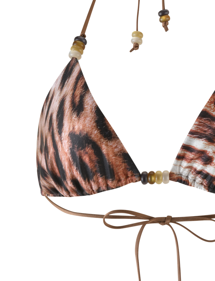 A close-up of the TIGERMIST FINLEA BIKINI TOP in Leopard Haze, featuring an adjustable triangle fit with a leopard print pattern, decorative beads on the straps, and a brown tie bow at the bottom.