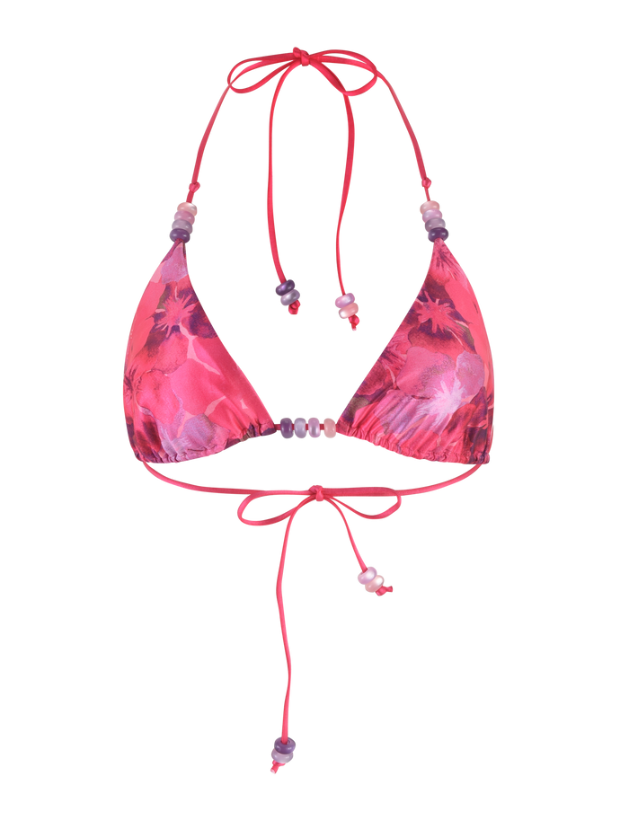 The FINLEA BIKINI TOP - PINK : HIBISCUS by TIGERMIST is a pink triangle bikini top with purple and white hibiscus prints, adjustable halter neck and back ties, plus beaded strap details.