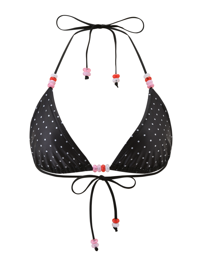 The TIGERMIST FINLEA BIKINI TOP - POLKA DOT BLACK CREAM features triangle cups, a halter neck, and adjustable black strings with pink and red beaded accents.