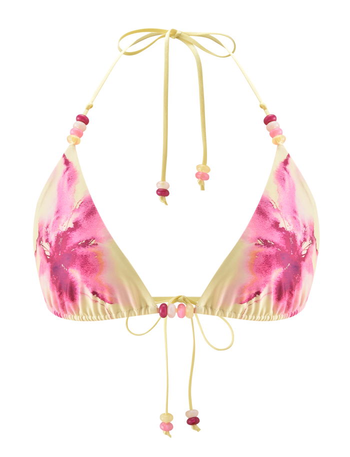 The FINLEA BIKINI TOP by TIGERMIST features a yellow and pink tie-dye design with an adjustable halter neck, front ties, and pink and red beaded straps, evoking a watercolour floral look.