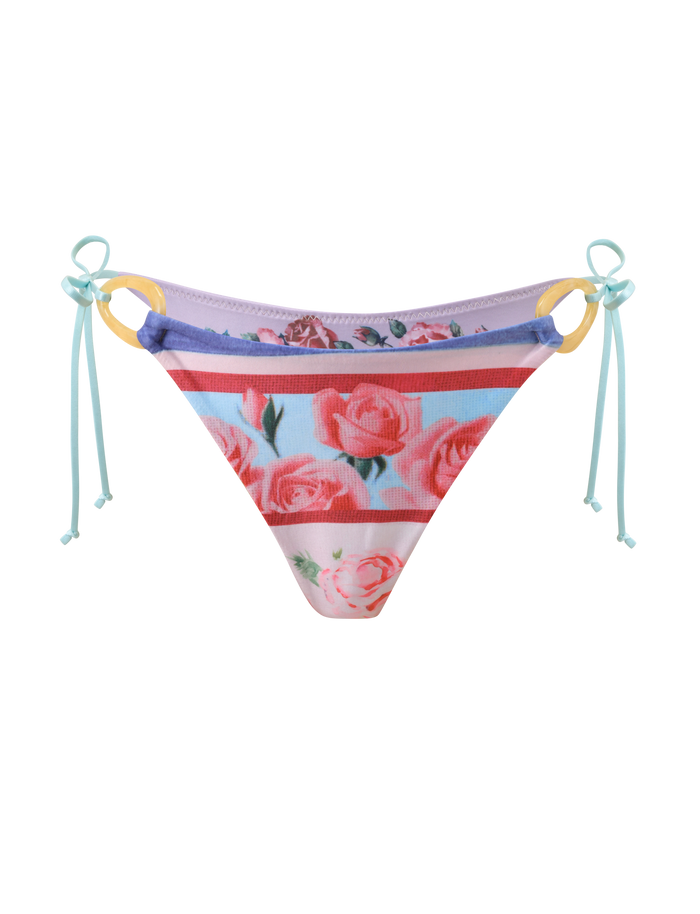 The TIGERMIST FINLEA RESIN RING BIKINI BOTTOM - POSTCARD PRINT features pink roses, purple trim, yellow resin side rings, and light blue adjustable string ties in a cheeky cut, shown on a white background.