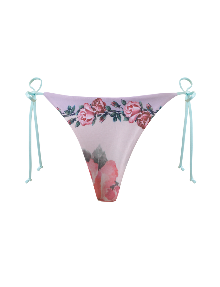 The TIGERMIST FINLEA RESIN RING BIKINI BOTTOM in postcard print features a pink floral design with blue side ties, shown on a plain white background.