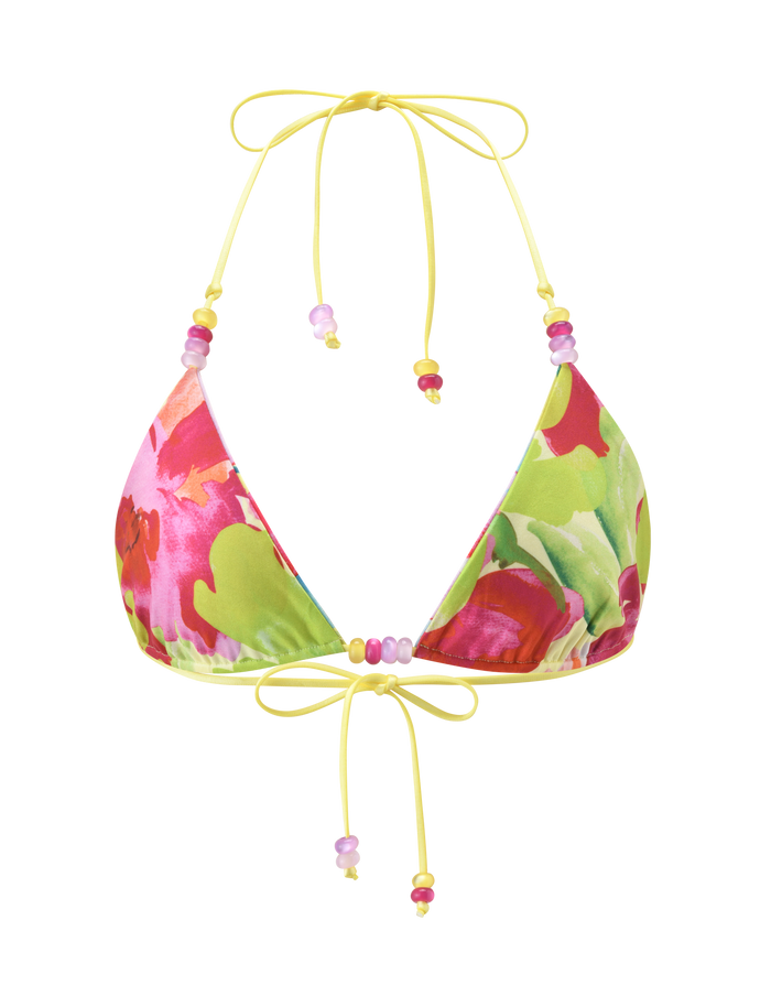The TIGERMIST FINLEA REVERSIBLE BIKINI TOP - GARDEN DAIQUIRI FLORAL features a vibrant pink, red, and green floral pattern with yellow strings and beaded strap accents, shown on a plain white background.