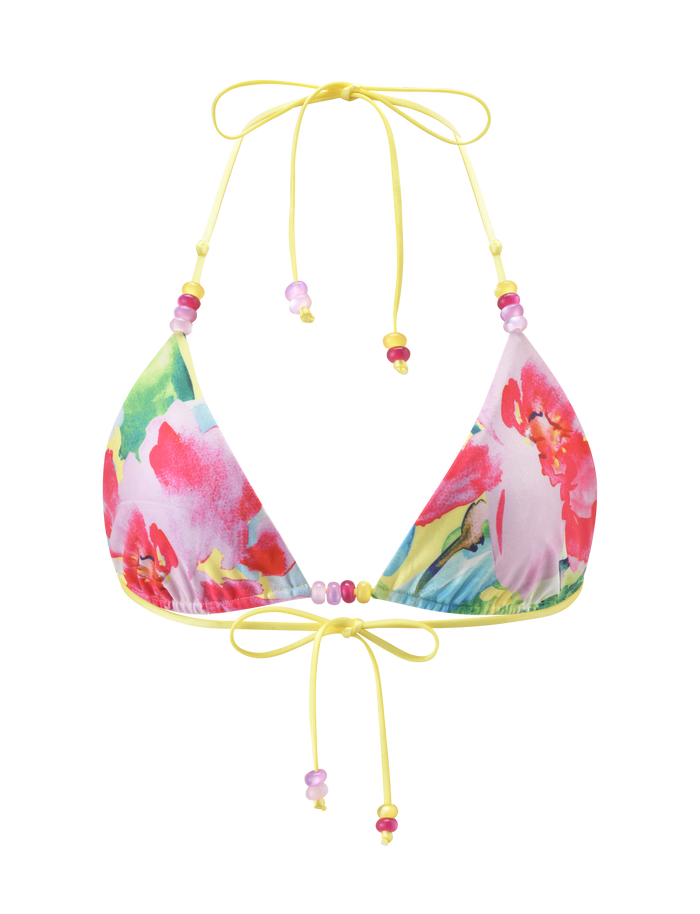 The TIGERMIST FINLEA REVERSIBLE BIKINI TOP in Garden Daiquiri Floral showcases pink, red, and green floral patterns with yellow ties and pink-purple bead accents, displayed against a white backdrop.