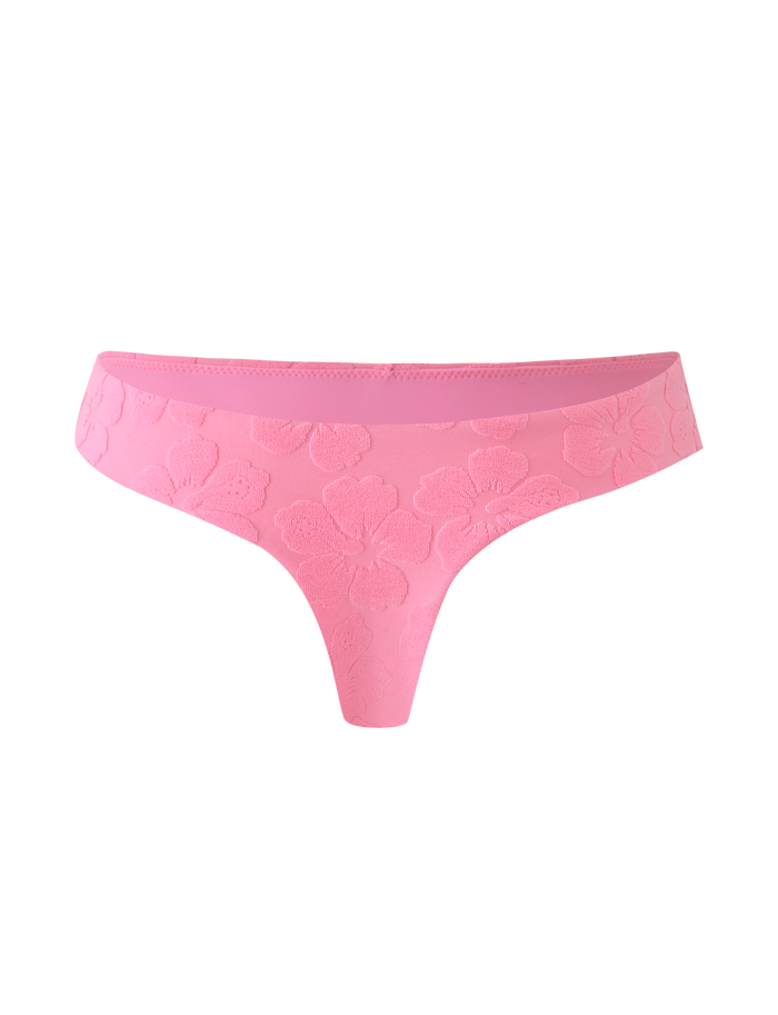 The TIGERMIST FIORA BIKINI BOTTOM in baby pink features cheeky coverage and delicate floral embossing, shown against a light pink background.