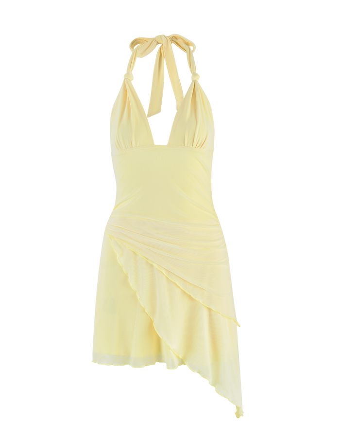 The TIGERMIST FRIEDA DRESS - YELLOW: BUTTER is a halter-style, sleeveless mini dress with a fitted bodice, deep V-neckline, and asymmetrical layered skirt, made from soft fabric with a gentle sheen.