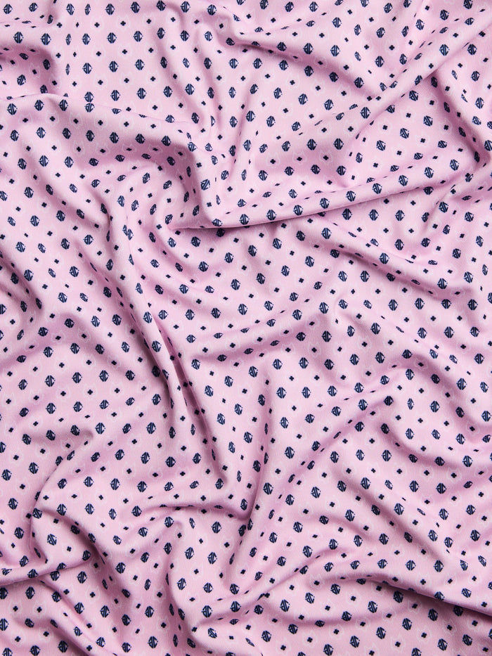 Sunrise Ghost Dreamer Polo - Fabric Detail, All-Over Wolf Motif Print on Performance Stretch Fabric | Greyson Clothiers