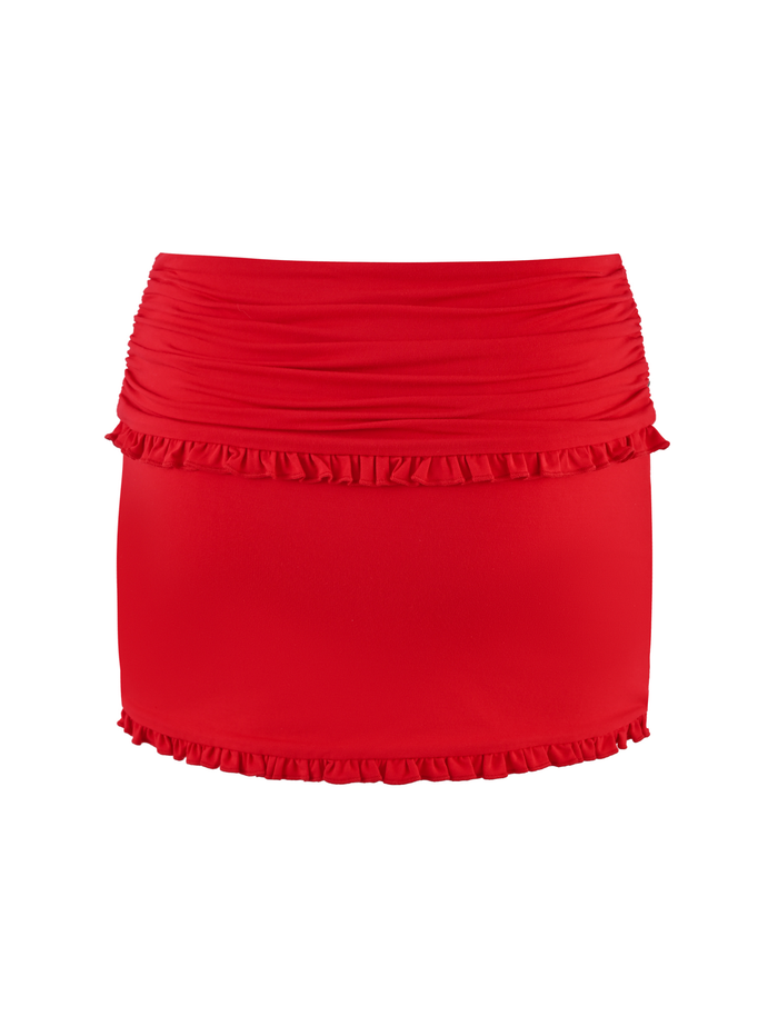 The TIGERMIST GINNY SKORT in red features a ruched waistband and ruffle trim at the top and bottom edges, shown against a white background.