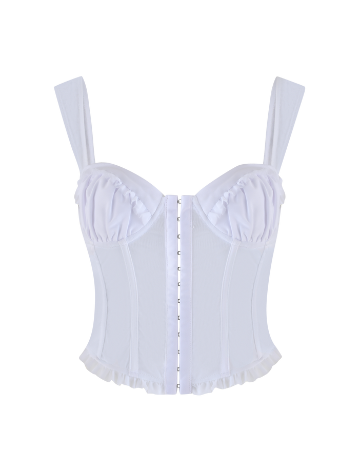 The GINNY TOP - WHITE by TIGERMIST is a corset-style top in optic white, featuring wide straps, structured boning, a ruffled trim, front button or hook closure, and a sweetheart neckline with slightly shiny fabric for an elegant touch.