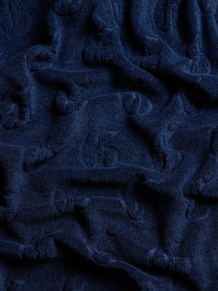 Gothic G Jacquard Terry Polo - Draped Fabric Texture Close-Up, Maltese Blue | Greyson Clothiers