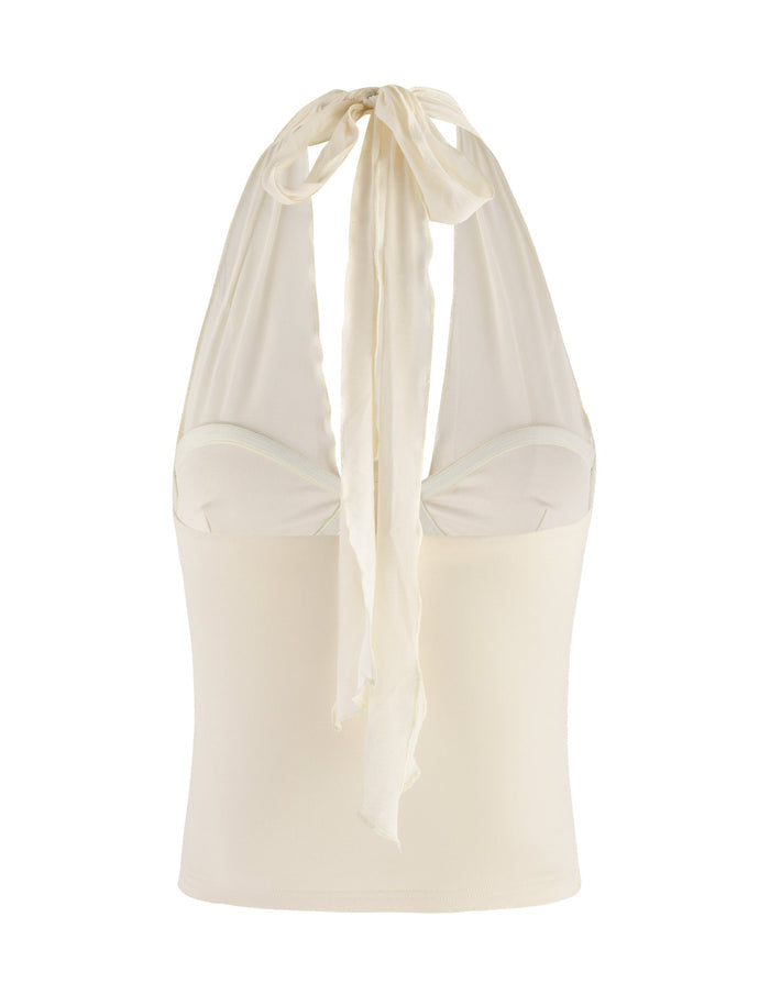 Introducing the GRANGER TOP by TIGERMIST: a stunning cream-colored halter top adorned with a stylish bow tie at the neck. It boasts a fitted bodice and a sweetheart neckline, crafted from soft fabric that elegantly drapes at the back, creating a sophisticated and chic bodycon silhouette.