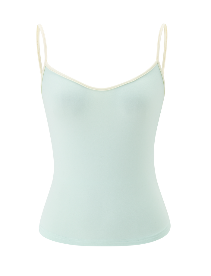 The GREER TOP by TIGERMIST is a mint green sleeveless camisole with a scoop neckline, thin white adjustable spaghetti straps, and a white trim on the neckline, shown against a plain white background.