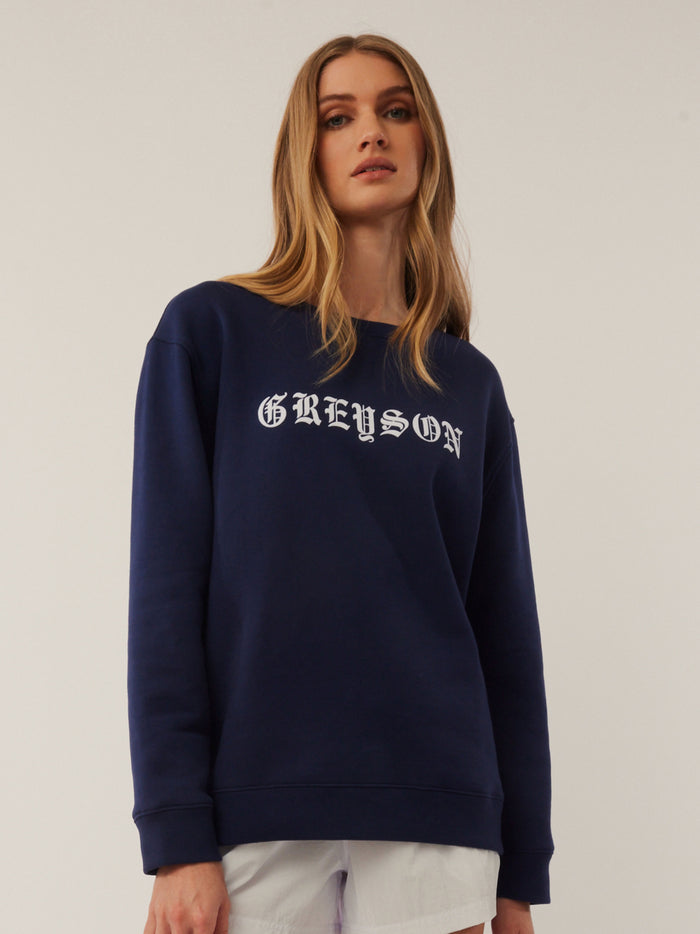 Greyson Aspen Crewneck in Maltese Blue - Front View, Gothic Logo Cotton Sweatshirt On Model | Greyson Clothiers