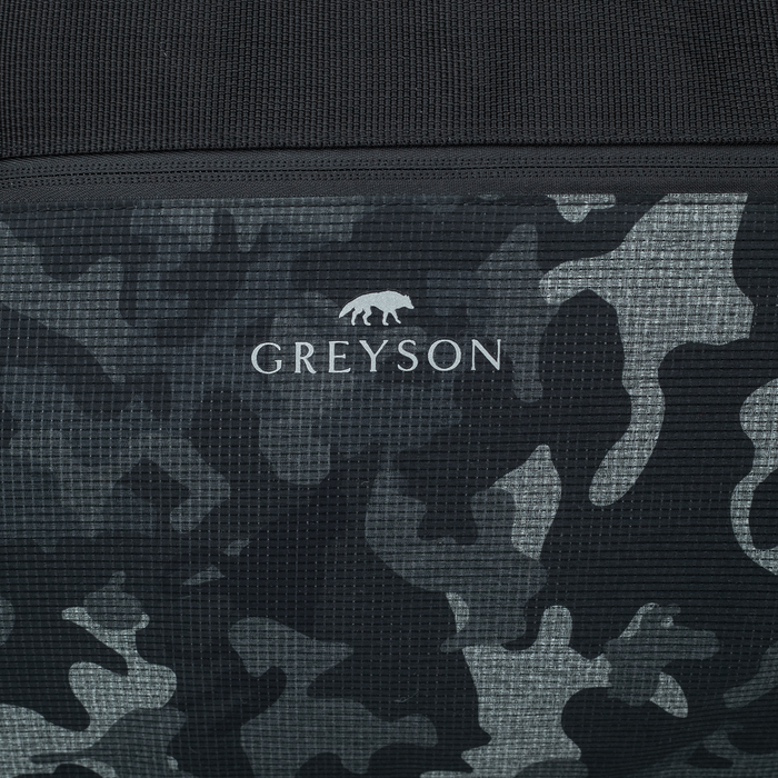 Greyson wolf logo on camoscape front pocket - Greyson x Jones 70L Dry Bag signature detail | Greyson Clothiers