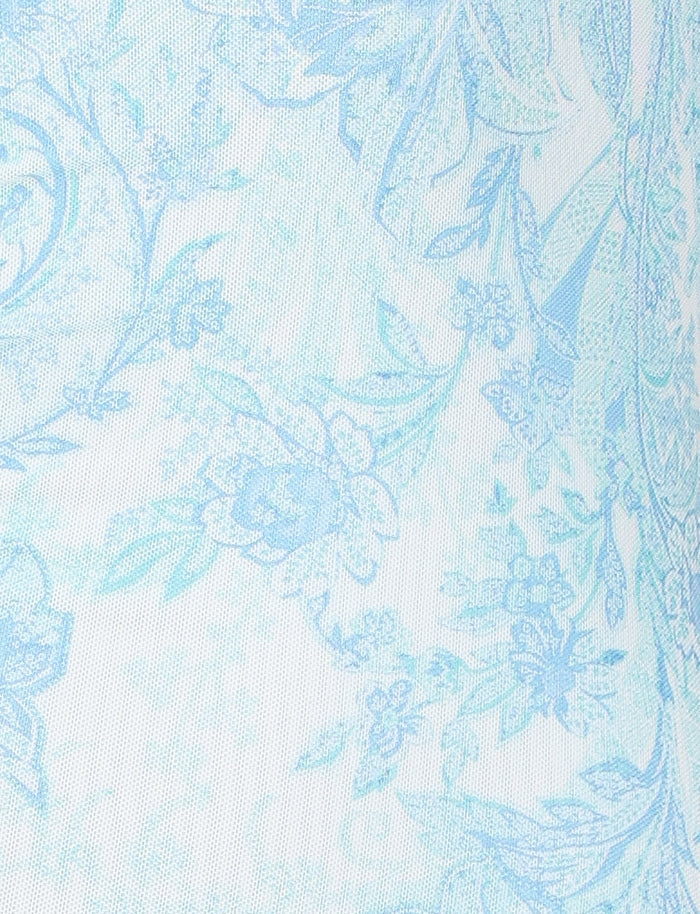 The GUILIANNA FRILL MAXI DRESS by TIGERMIST boasts a delicate light blue floral pattern with intricate designs set against a white fabric background. The frill shoulder straps add an elegant touch, while the asymmetric frill detail enhances its graceful appearance.