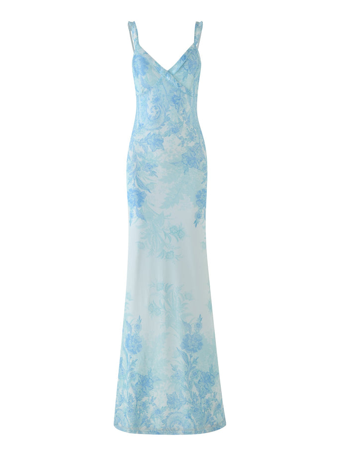 The GUILIANNA FRILL MAXI DRESS by TIGERMIST is a captivating piece in light blue, designed with a delicate floral tapestry. It features thin straps and a fitted silhouette with an elegant asymmetric frill detail.