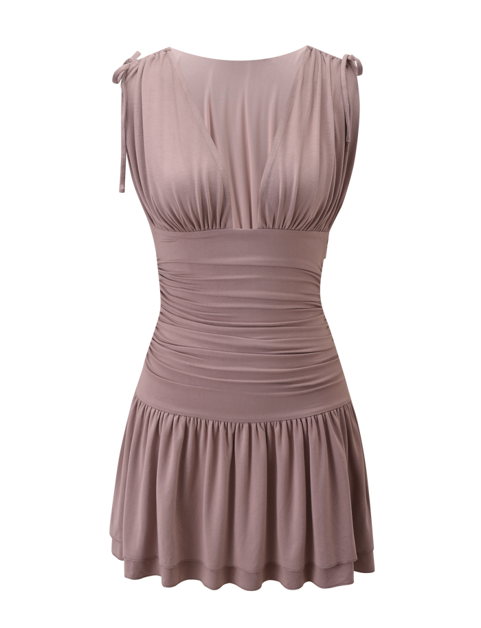 The HALONA MINI DRESS by TIGERMIST is a sleeveless mocha dress with a plunging neckline, ruched waist, gathered bust, tie shoulder straps, and a short flared skirt. Displayed on a plain white background.