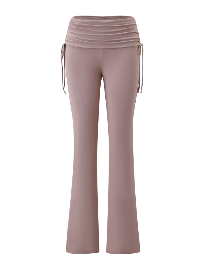 The TIGERMIST HALONA PANT - MOCHA features a high-waisted, flared silhouette in mocha with a ruched waistband and adjustable side drawstrings, shown against a plain white background.