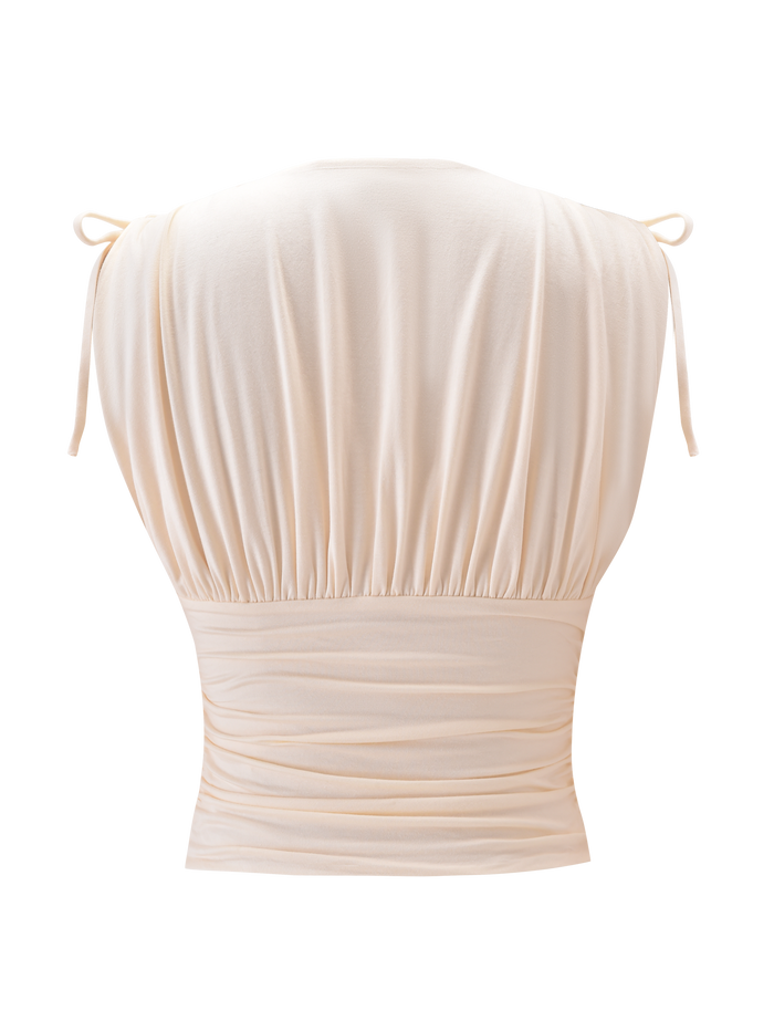 Back view of the TIGERMIST HALONA TOP in cream, featuring adjustable shoulder ties and gathered details at the shoulders and waist, with a fitted, ruched waistband for a flattering silhouette.