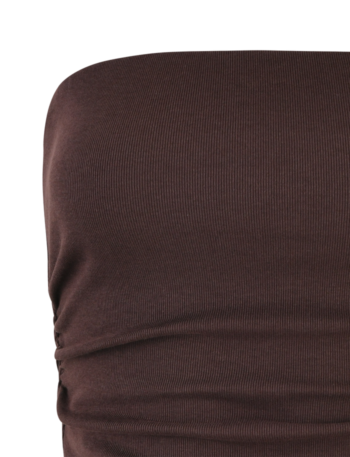 A close-up of the TIGERMIST HARRIETT RIB TOP - BROWN : CHOCOLATE, featuring ribbed jersey fabric and side ruching that creates a flattering, form-hugging silhouette.