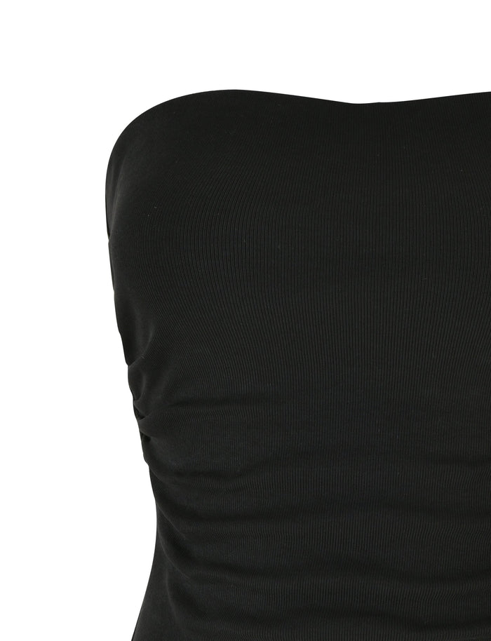 Close-up of the upper part of the HARRIETT RIB TUBE TOP - BLACK by TIGERMIST, highlighting its bodycon silhouette. The ribbed fabric is slightly ruched on one side, adding a textured look. The background is plain white.