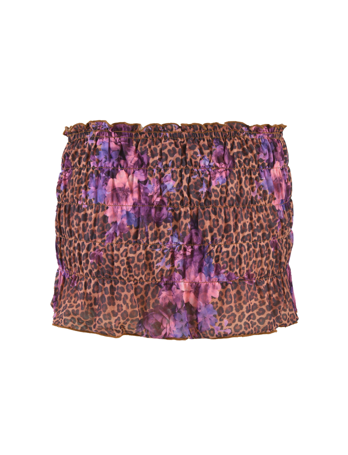 The HOLLIS SKORT by TIGERMIST is a strapless, ruched super mini skort in a neutral floral leopard print with purple and pink floral accents.