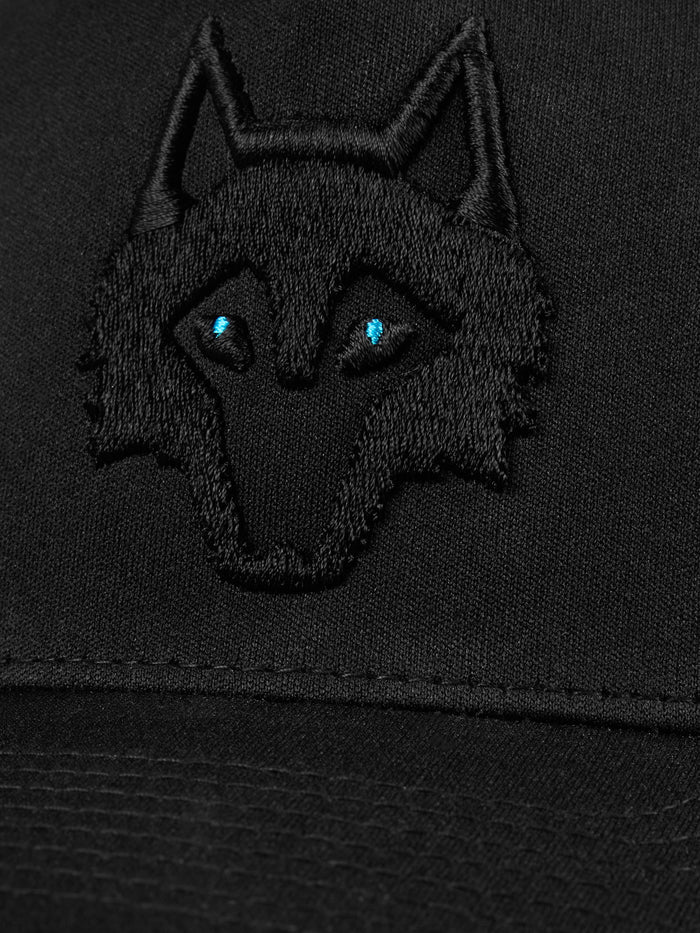 Greyson Icon Trucker Hat Shepherd/Shepherd - Close-Up Tonal Black Wolf Embroidery, Blue Eye Detail | Greyson Clothiers