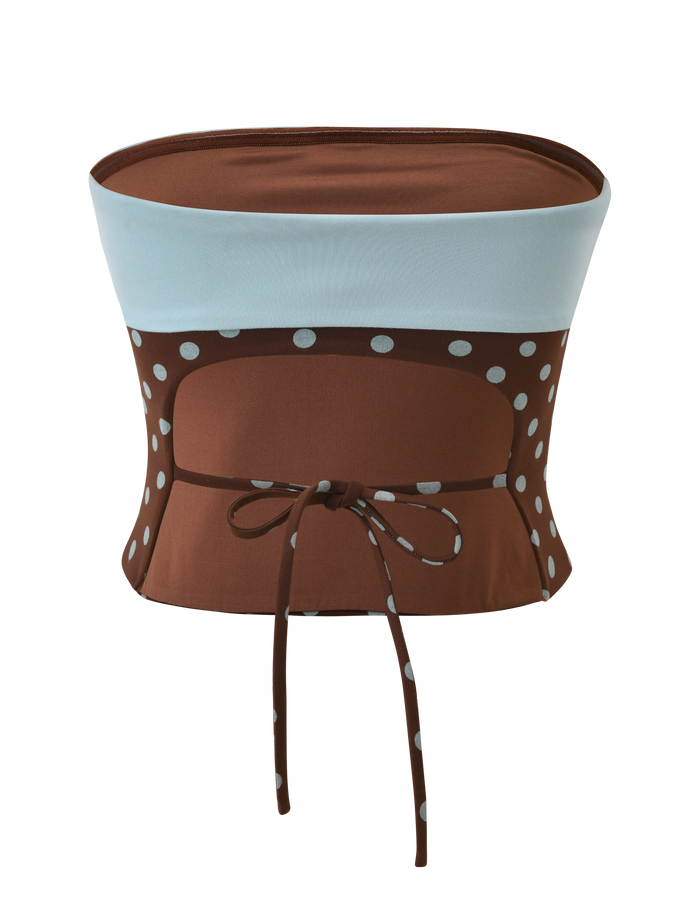 The TIGERMIST IMOGEN TUBE TOP - BROWN AND BLUE POLKA DOT is a strapless top with a light blue band, playful polka dot print, and matching tied waist, shown against a white background.