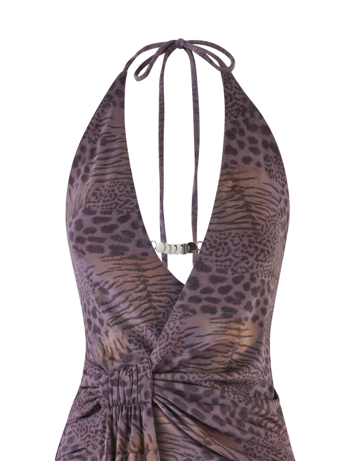 Close-up of the INDIGO MINI DRESS - PURPLE TIGER by TIGERMIST, a halter-neck mini dress featuring a deep V-neck, purple and brown tiger print, metallic chest detail, high-stretch fabric, and ruched waist for a flattering fit.