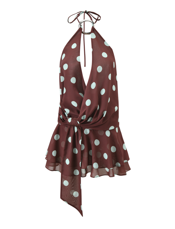 The TIGERMIST INDIGO MINI DRESS 2.0 in Chocolate Blue Dot features a sleeveless halter neckline, deep V-neck, blue polka dots, ruffled peplum hem, and waist tie—ideal to style with your go-to micro mini skirt.