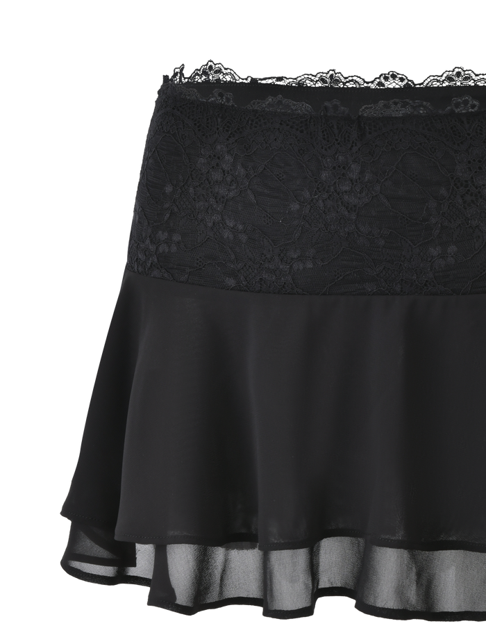 The INDIGO SKIRT - BLACK by TIGERMIST features a wide lace waistband, semi-sheer black chiffon, and a flowy layered hem for a stylish, feminine look that blends lace and chiffon textures.