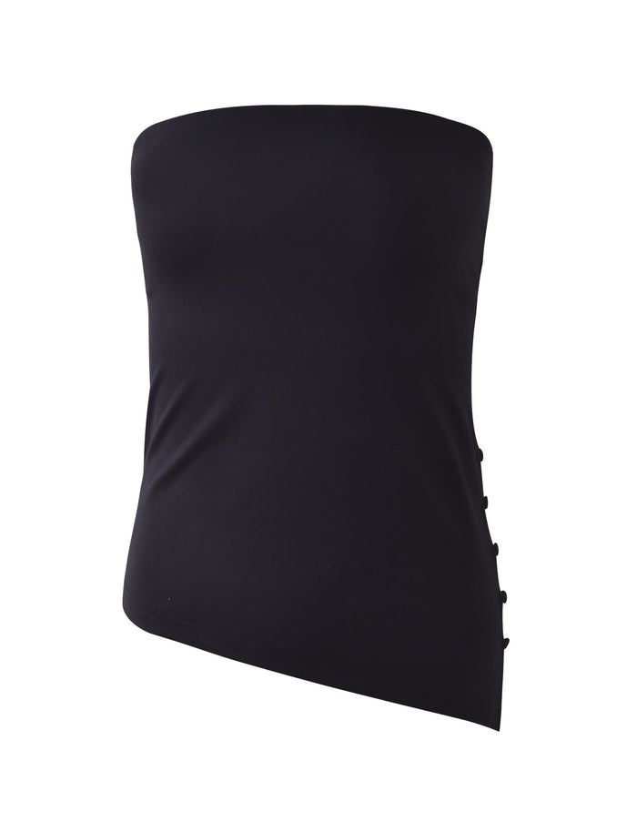 The INDIRA TOP - BLACK from TIGERMIST is a black, strapless asymmetrical top with side button details, featuring a straight neckline and a slightly angled hem for a modern and stylish touch.