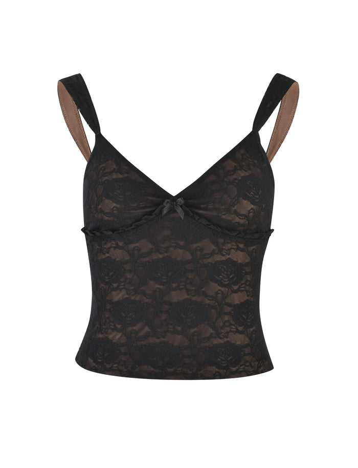 The ISADORA TOP - BLACK : LACE from TIGERMIST is a black lace camisole with wide shoulder straps, a V-neckline, and a small bow at the center front. It features a floral lace pattern and a fitted silhouette, offering a delicate and elegant appearance.