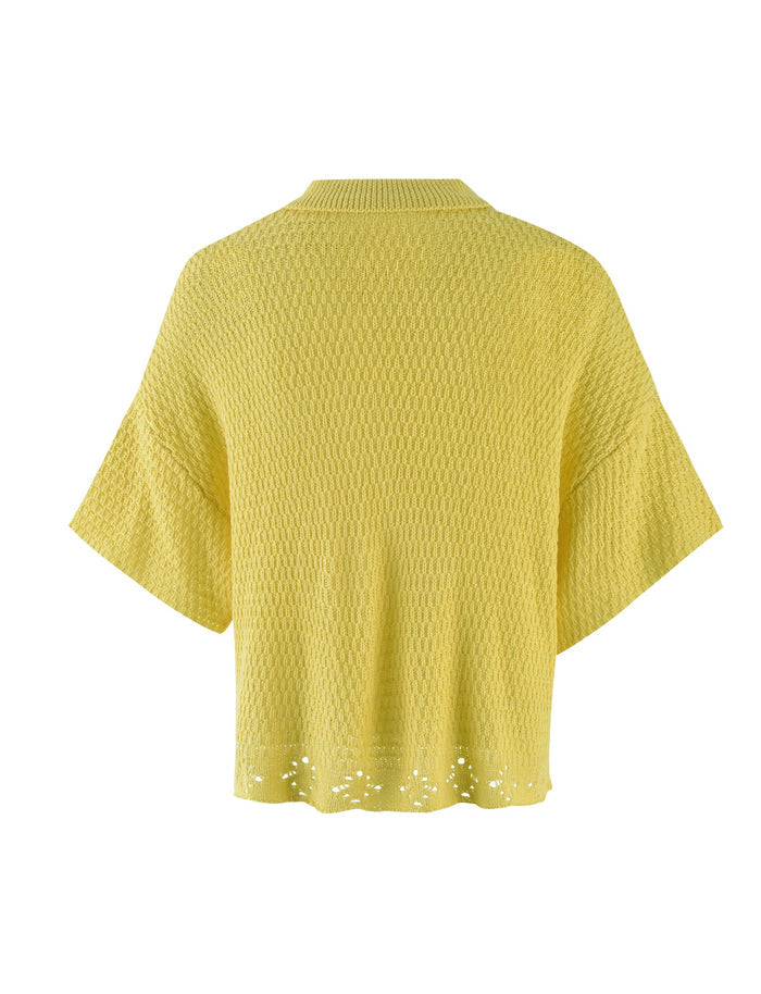The JANAI TOP - YELLOW : LEMON from TIGERMIST is a yellow knit cardigan with short, wide sleeves. The fabric has a textured pattern, and the hem is adorned with a small, intricate cutout design. The back view showcases a relaxed, slightly loose fit.