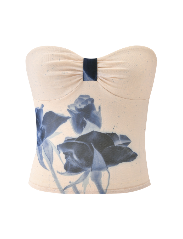 The JANIS TOP - INDIGO FLORAL by TIGERMIST is a cream strapless sweetheart tube top with center-gathered detail and an eye-catching blue rose floral mesh print at the front.