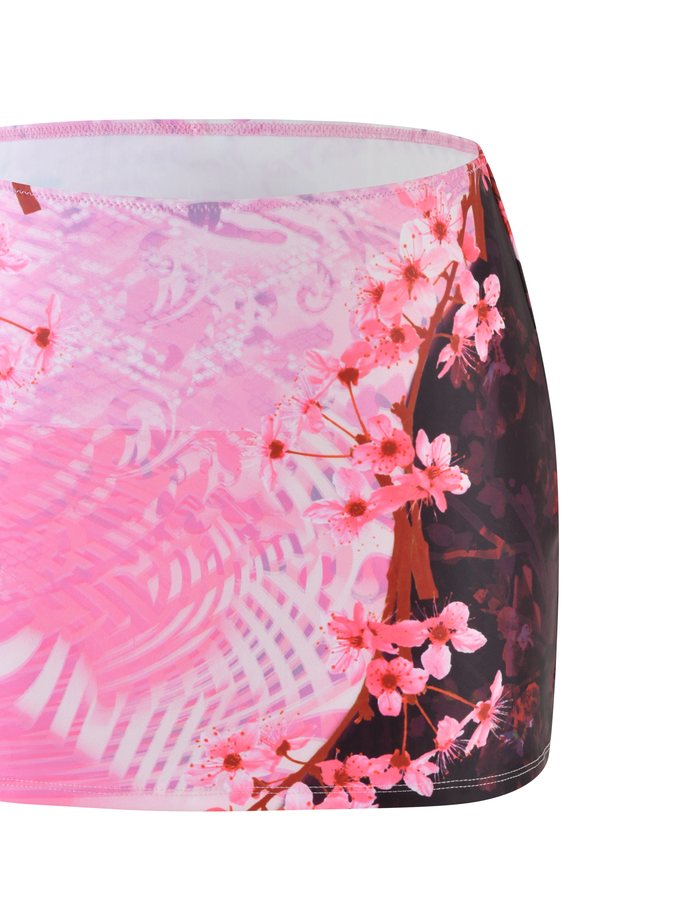 A close-up of the TIGERMIST JOVANNA MINI SKIRT in MULTI, showcasing an exclusive animal floral border print with abstract designs on a white background.