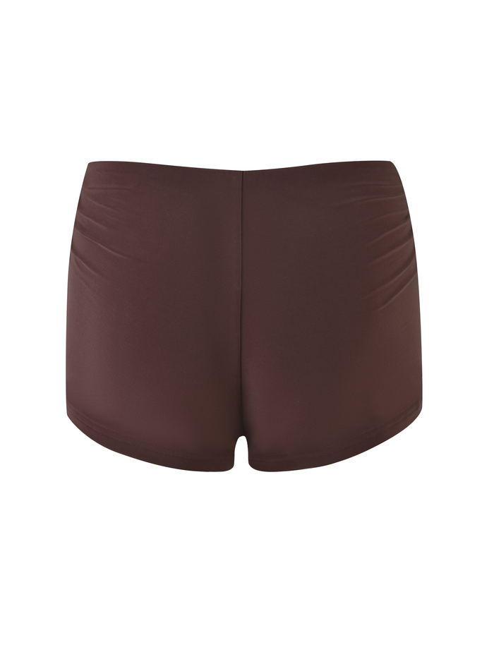 The JOVIENNE SHORT - BROWN : CHOCOLATE by TIGERMIST features high-waisted, chocolate brown jersey micro mini shorts made from high-stretch fabric, displayed from the back against a white background.