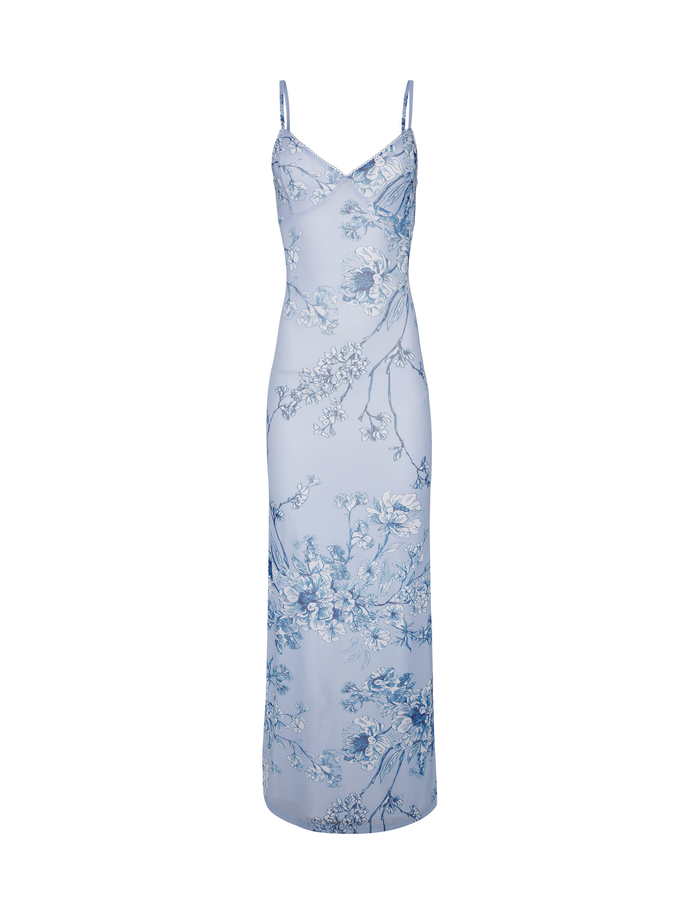 The JULIANNA DRESS by TIGERMIST is a sleeveless, light blue maxi dress with thin straps and a delicate Blue Ceramic Floral print in blue and white.