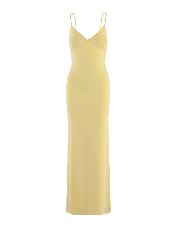 Introducing the JULIANNA DRESS - YELLOW : LEMON from TIGERMIST. This long, pale yellow slip dress features a fitted silhouette with spaghetti straps and an elegant, understated design that flares slightly at the bottom hem.